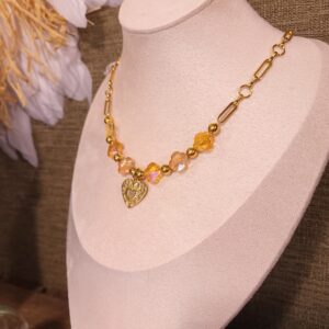 Collier acier et perle de verre trèfle.